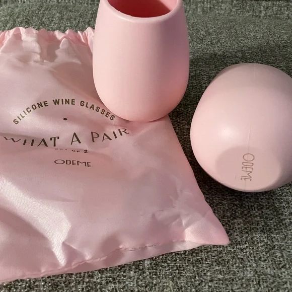 New Odeme silicone wine glasses (2) with carry bag. Pink rose color. $20.00